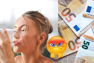 žena pije vodu a vedla nej sú euro bankovky